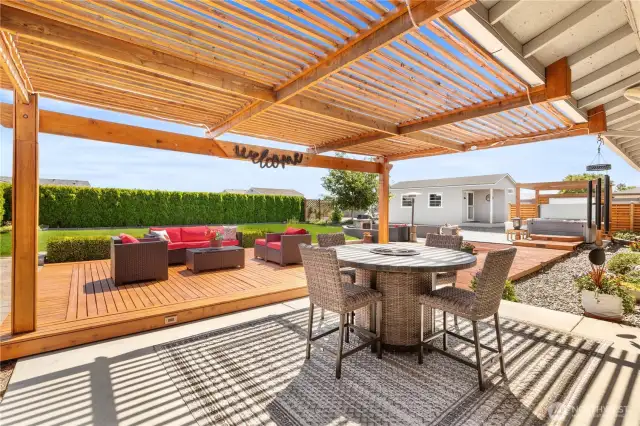 Fully fenced private backyard with patio and deck.