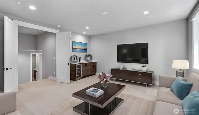 Rec Room is pre-wired with 7.1 Surround Sound and for a projector. With a wet bar and beverage refrigerator, you're set for game day! Virtually staged.