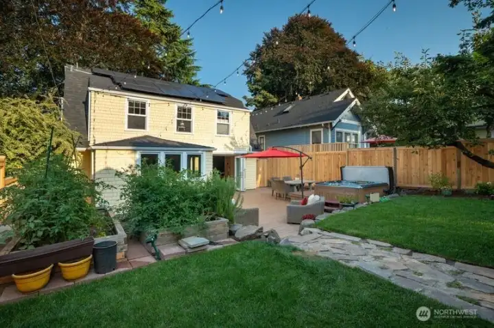 The one-car garage is conveniently located off of the alley. There is room to park a second car alongside then new cedar fence.