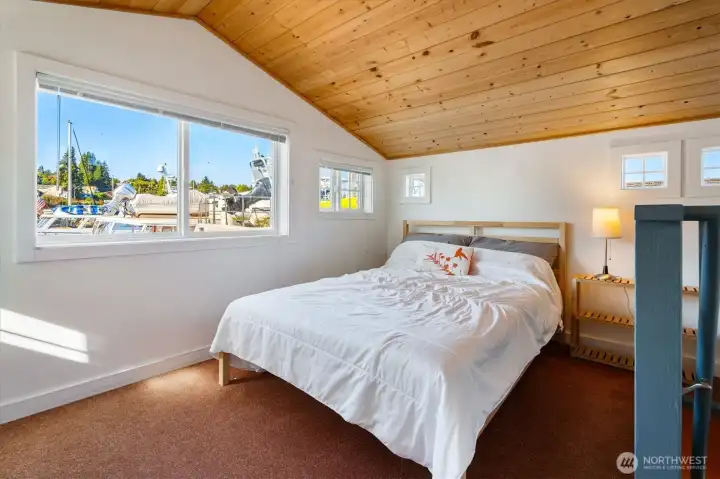 Up the stairs, find a sunny, welcoming bedroom.