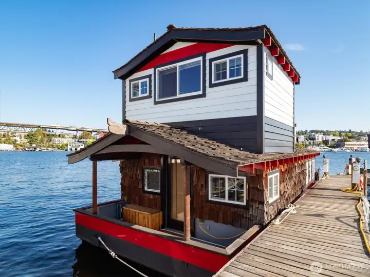 The houseboat occupies the last slot on the dock, making for convenient and view-filled living.