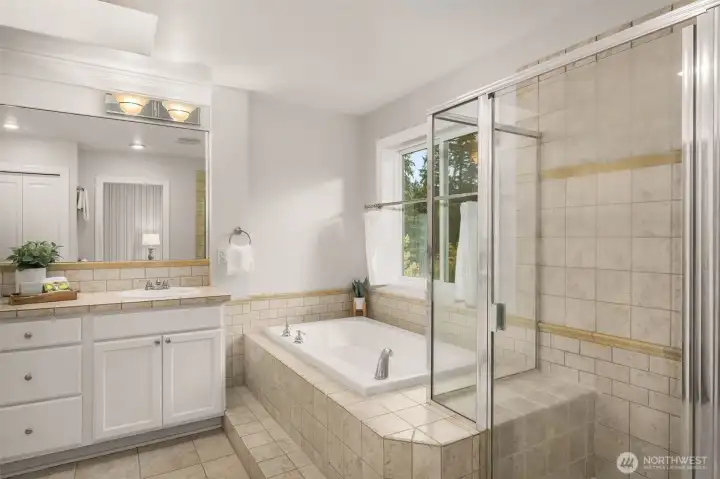 Primary soaking tub and shower with a view and privacy.