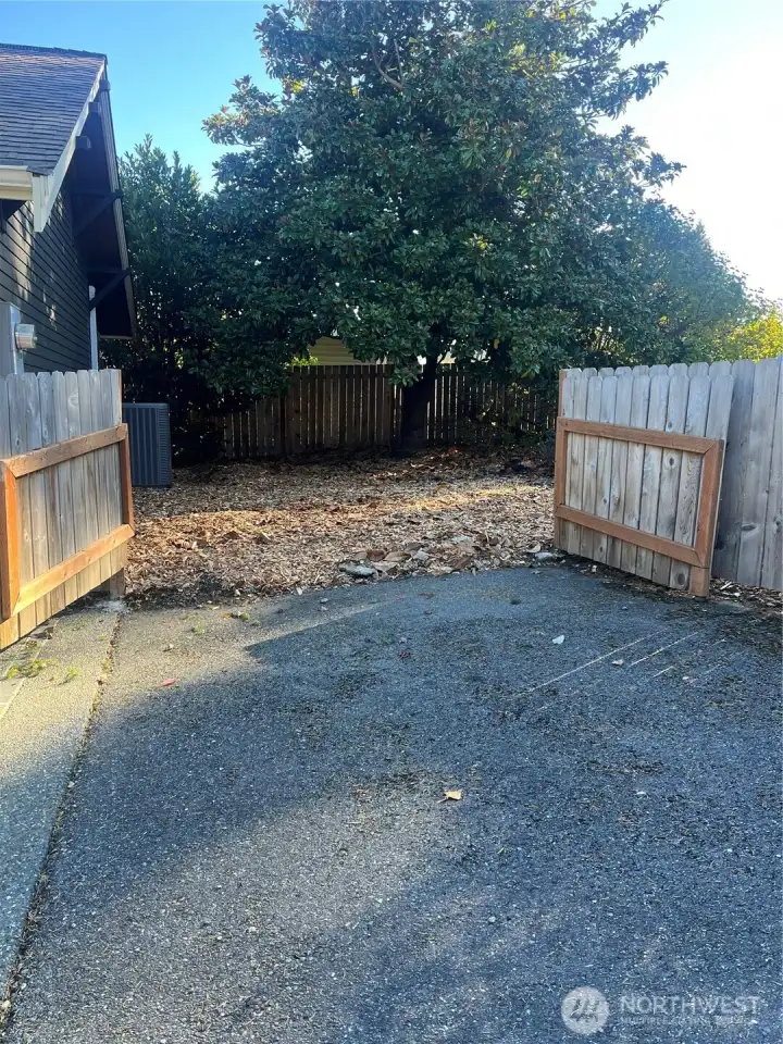 Opening the gate off of the 4th parking spot creates plenty of room to park a large RV