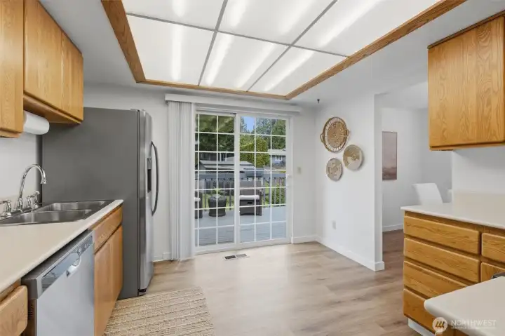 Bright and spacious kitchen with deck access for seamless indoor-outdoor living.