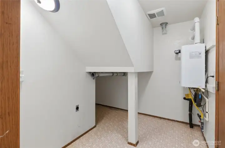 Laundry Room with extra storage + High Efficiency Tankless Water Heater