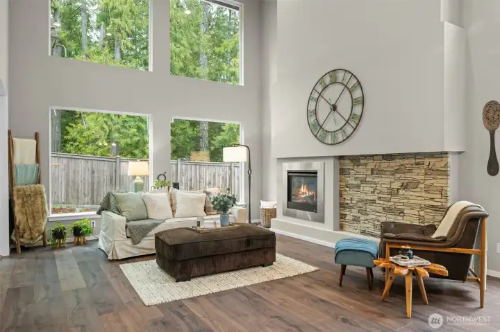 Living Room with Cozy Gas Fireplace, High Vaulted Ceilings and Large Picture Windows