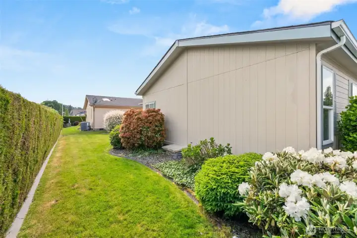 Side yard. All beautifully landscaped Side yard. All beautifully landscaped