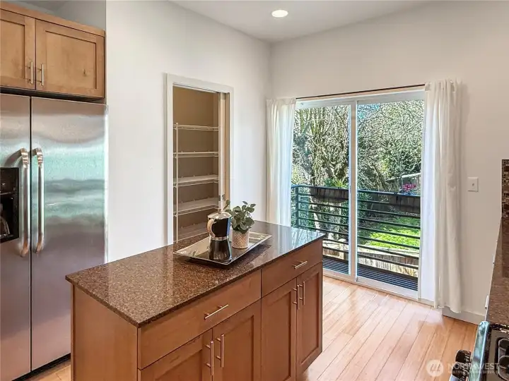 Kitchen with balcony and walk-in pantry