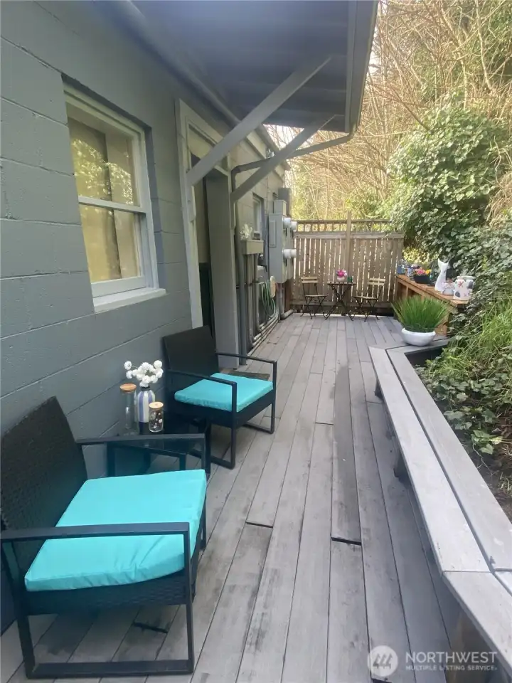 Outdoor seating area off upstairs residential units.