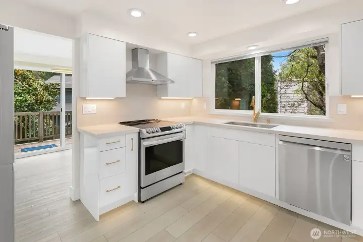 Contemporary Kitchen Remodel - Under-cabinet Lighting, LED Recessed Ceiling Lights with Night Light Toggle, Stainless Appliances, Slab Quartz Counters with Undermount Trough Sink, Luxury Vinyl Plank Flooring