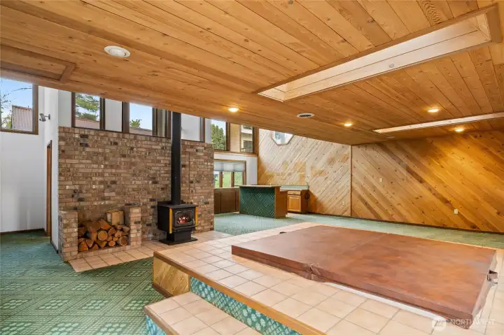 Retro in all the best ways; warm wood ceilings, skylights, and space built for memories.