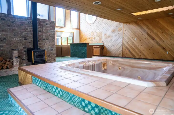Long before "staycations" were a thing, this room had it figured out—hot tub bubbling, fire crackling, and good company close by. Long before "staycations" were a thing, this room had it figured out—hot tub bubbling, fire crackling, and good company close by.