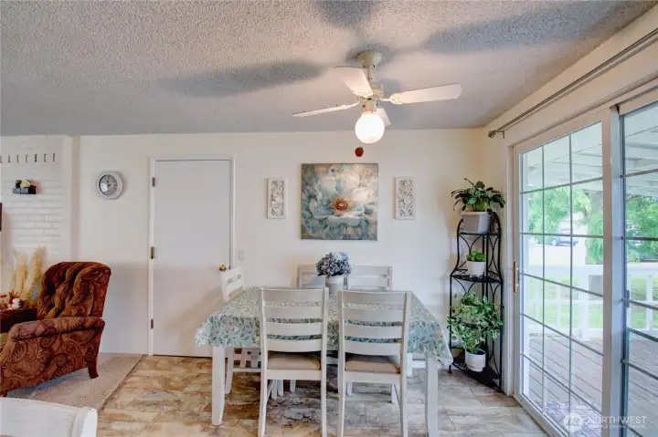 Door leads to attached garage off dining room and slider leads to covered back deck. Door leads to attached garage off dining room and slider leads to covered back deck.