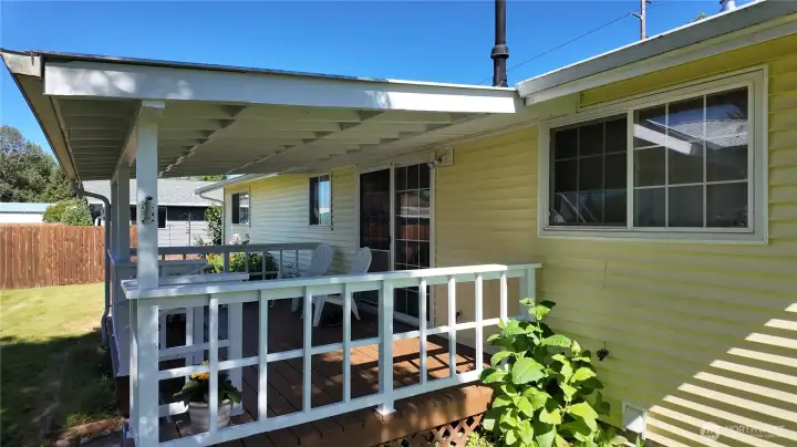 Covered back deck with slider to dining room. Covered back deck with slider to dining room.