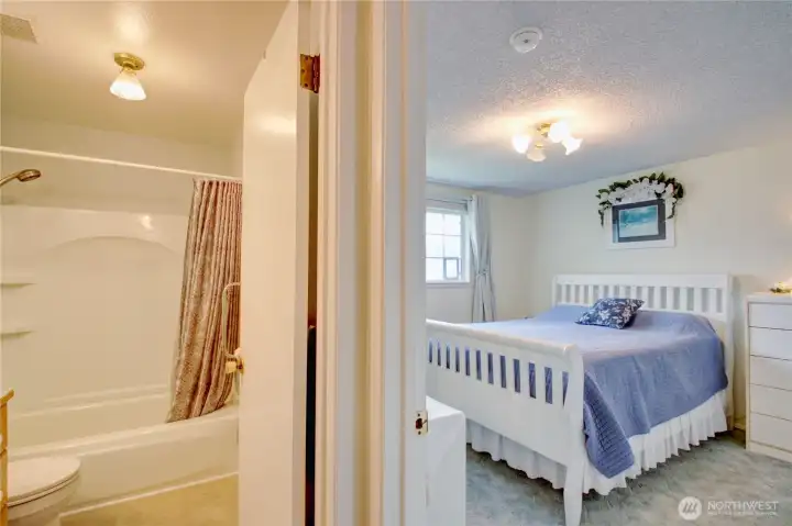 Primary bedroom next to bathroom. Primary bedroom next to bathroom.