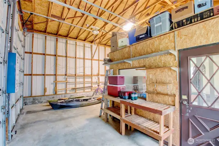 Shop right bay door features office space with door, half bath and loft above. Shop right bay door features office space with door, half bath and loft above.