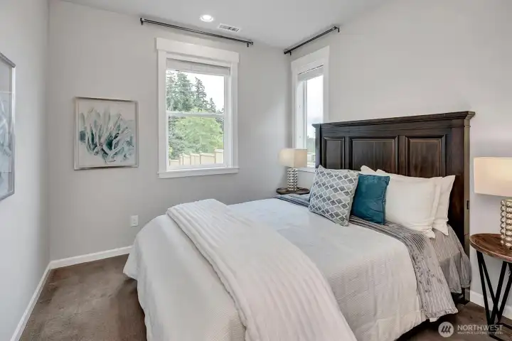 Main level bedroom with adjacent full bath