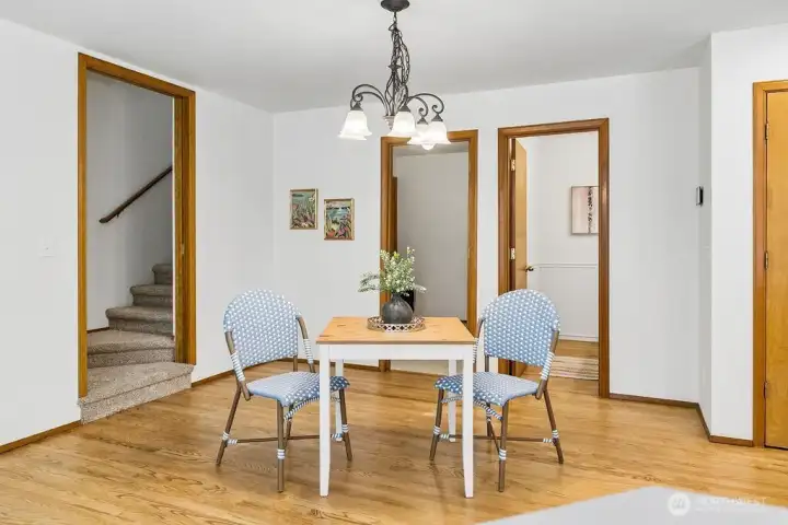 Half bath to the right and stairs to the recreation bonus room on the left.