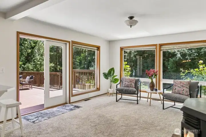 Such a welcoming room with plenty of natural lighting just off the deck, and eat in kitchen area.