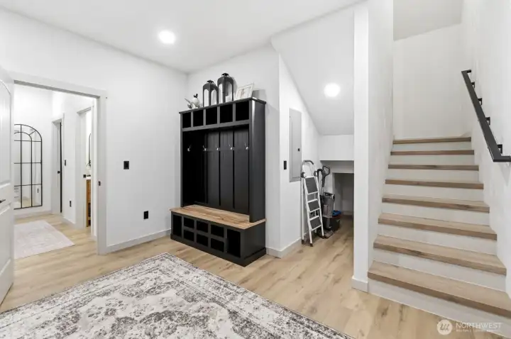 Laundry/entry from garage, these stairs go up to the bonus room