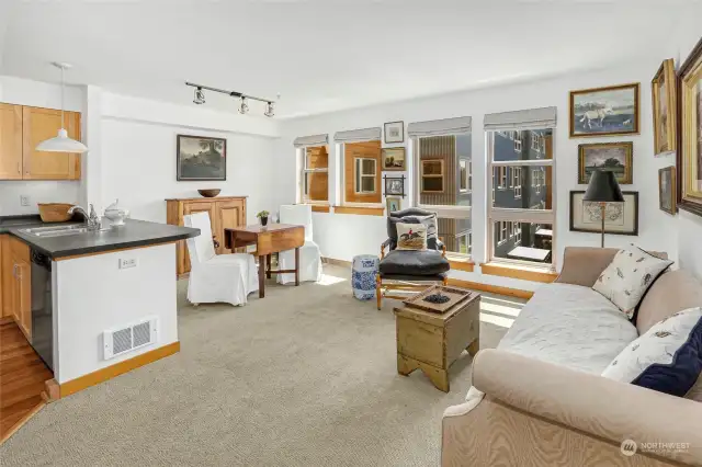 The living room seamlessly flows into the dining area and kitchen.