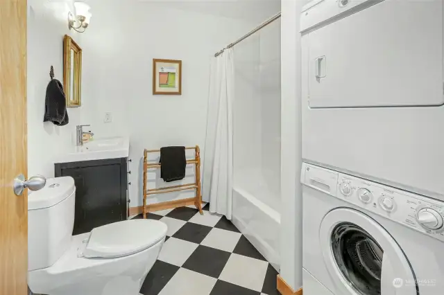 The full bathroom with a convenient in-unit washer and dryer.