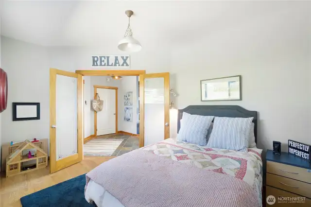 Main floor home office with French doors.