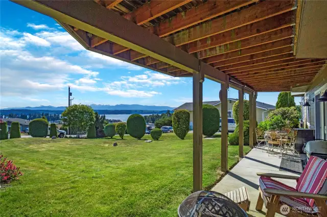 Outdoor Space – Plenty of room to relax and unwind. This is from the lower level, walk out to this view, gardens and lawn area!