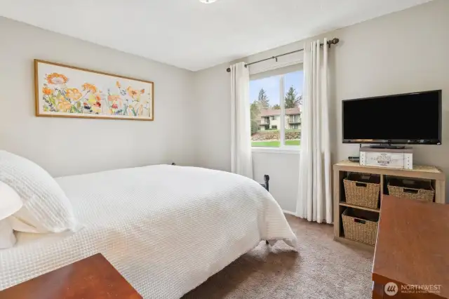 The second bedroom looks on to the open grass area