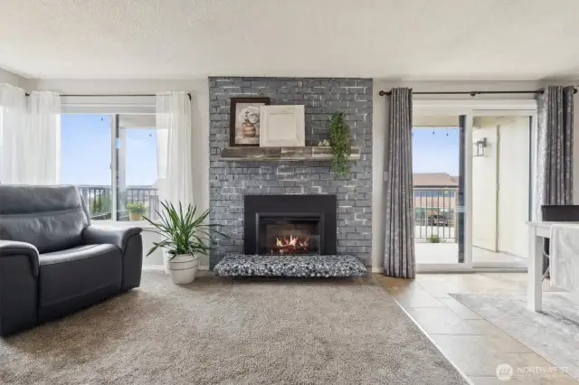The cozy electric fireplace adds comfort and ambiance to your home