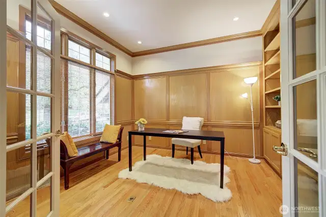 Library/office off entry with glass french doors and wood trim