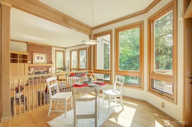 Sunny kitchen eating area overlooks back deck