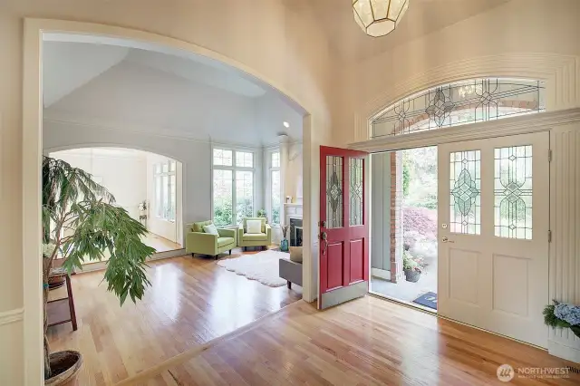 Grand Entry with vaulted ceilings, gleaming hardwoods