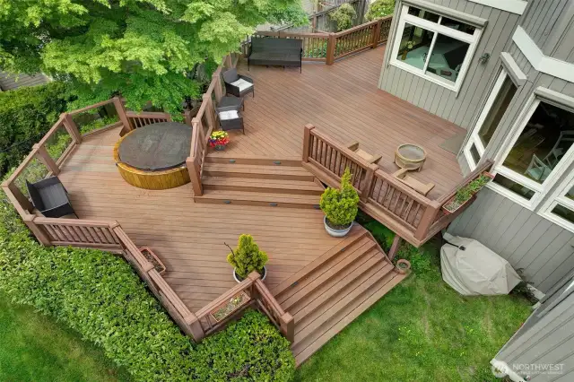 Soak in your private hot tub under the maple tree and enjoy lake views