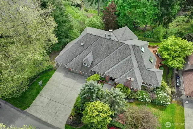 Surrounded by mature landscaping and trees