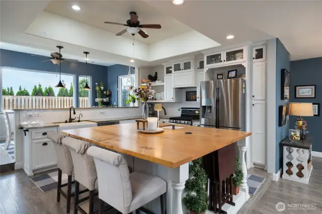 spacious kitchen open to the living room and dining room with views to the North and South