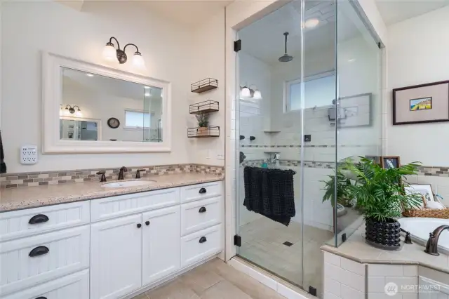 spacious primary bathroom with radiant heated flooring