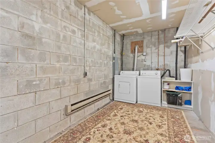 Laundry in garage serves flex room and upper level of main home