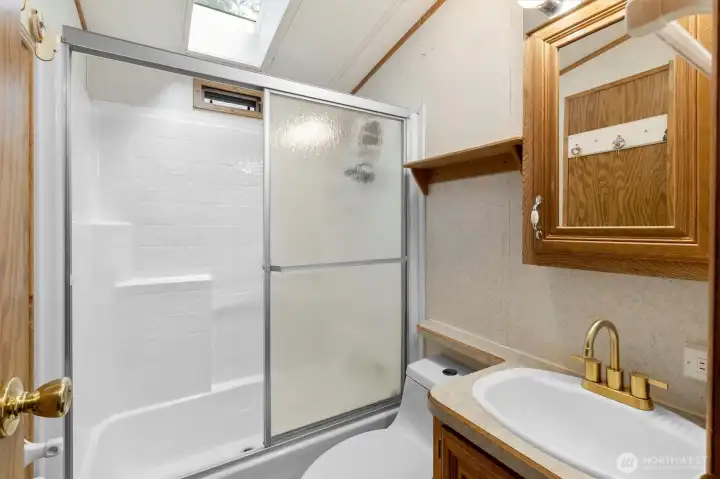 Bathroom with roomy shower.