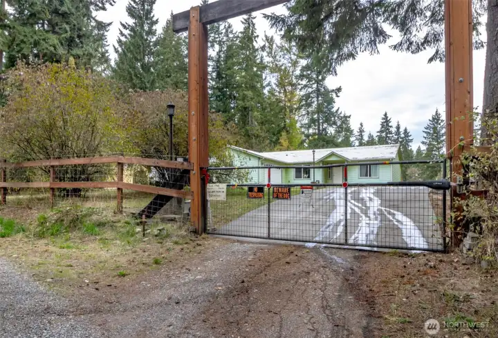 Gated entry down a private road