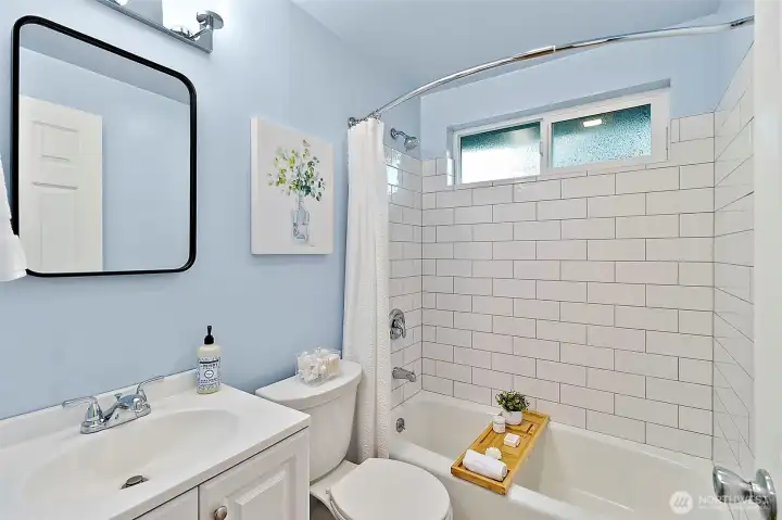 Modern fresh style full bath.
