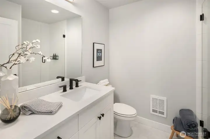 Lower level bathroom in bedroom suite.