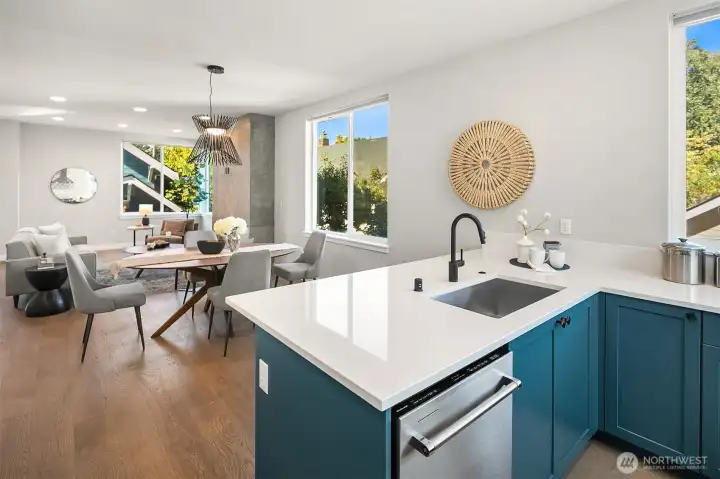 view from kitchen bar into dining and living room.