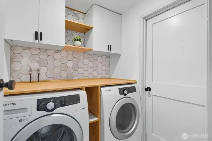 Utility room conveniently located.