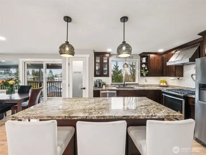 Kitchen eat-in island with granite countertops