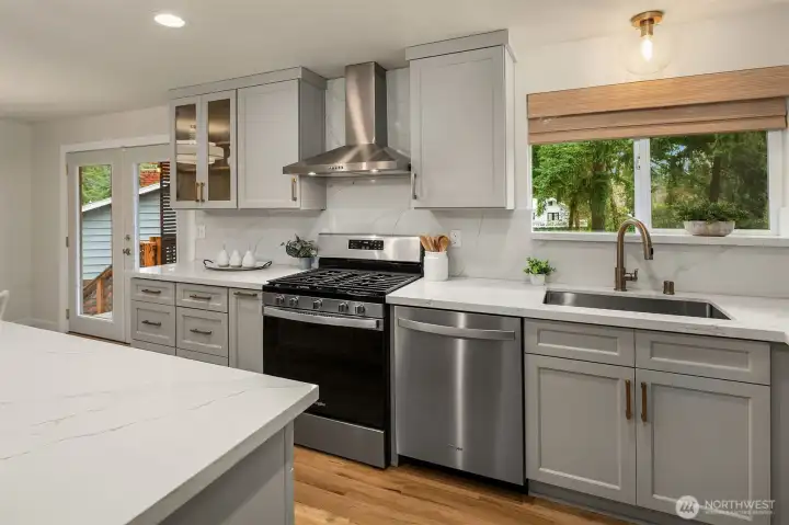 Bright and updated kitchen equipped with stainless steel appliances