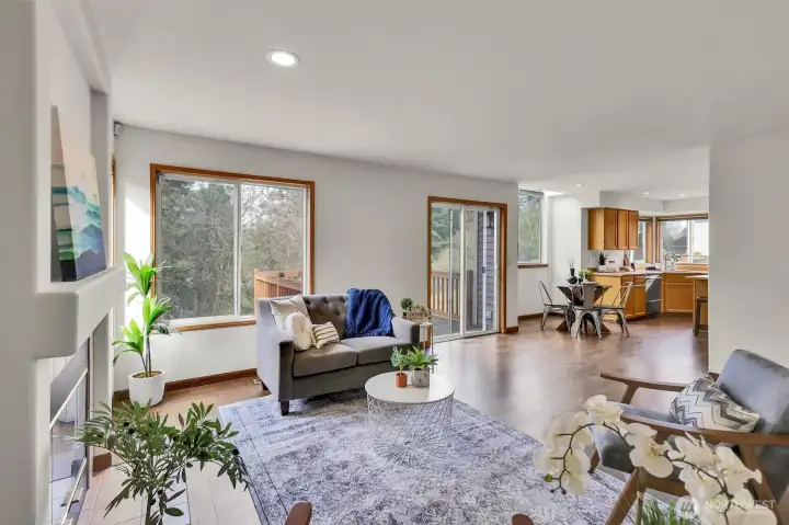 Great size family room off of kitchen has sliders that lead to outdoor deck just in time for summer gatherings.