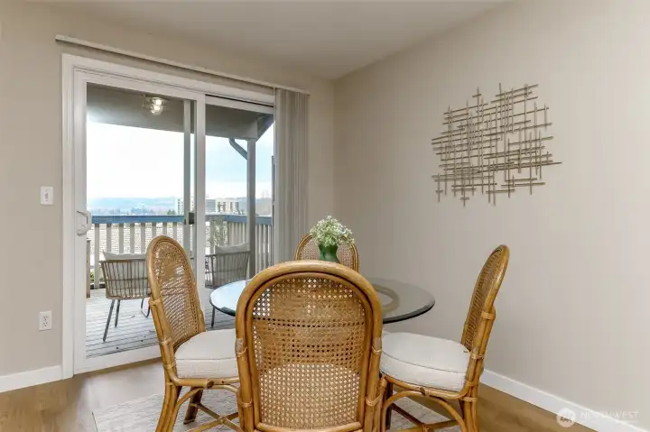 Dining room with sliding glass door to full length deck with tremendous views of the territory, and cascades.