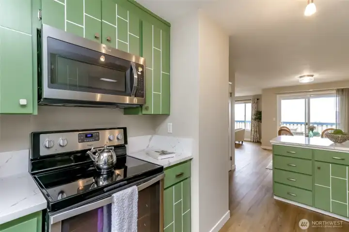 The opposite side of the kitchen with upgraded appliances.