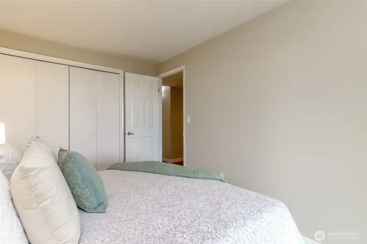 Double sided closet and leads out to the hallway, full bathroom, primary bedroom and full bathroom.